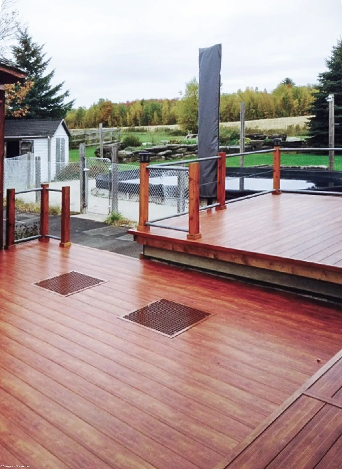 Elevated wooden patio in rural setting