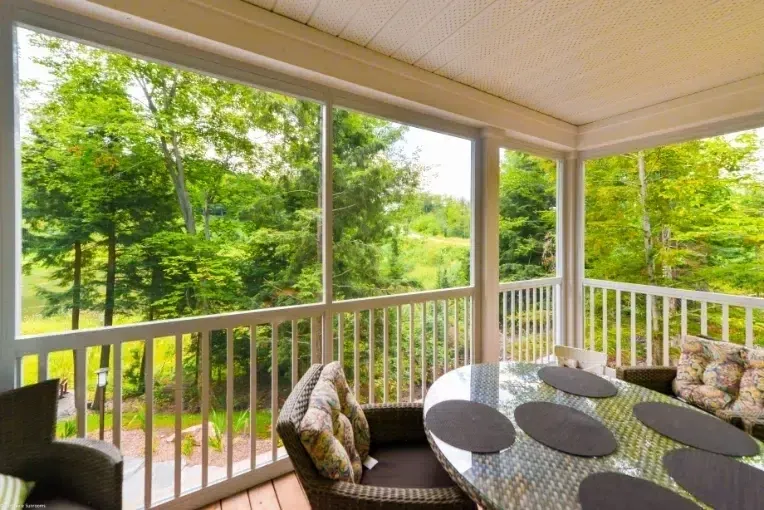 Cozy patio overlooking lush greenery