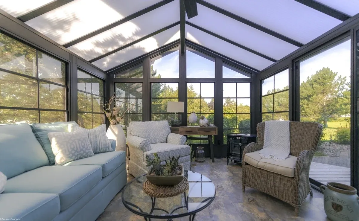 Sunlit conservatory with comfortable seating