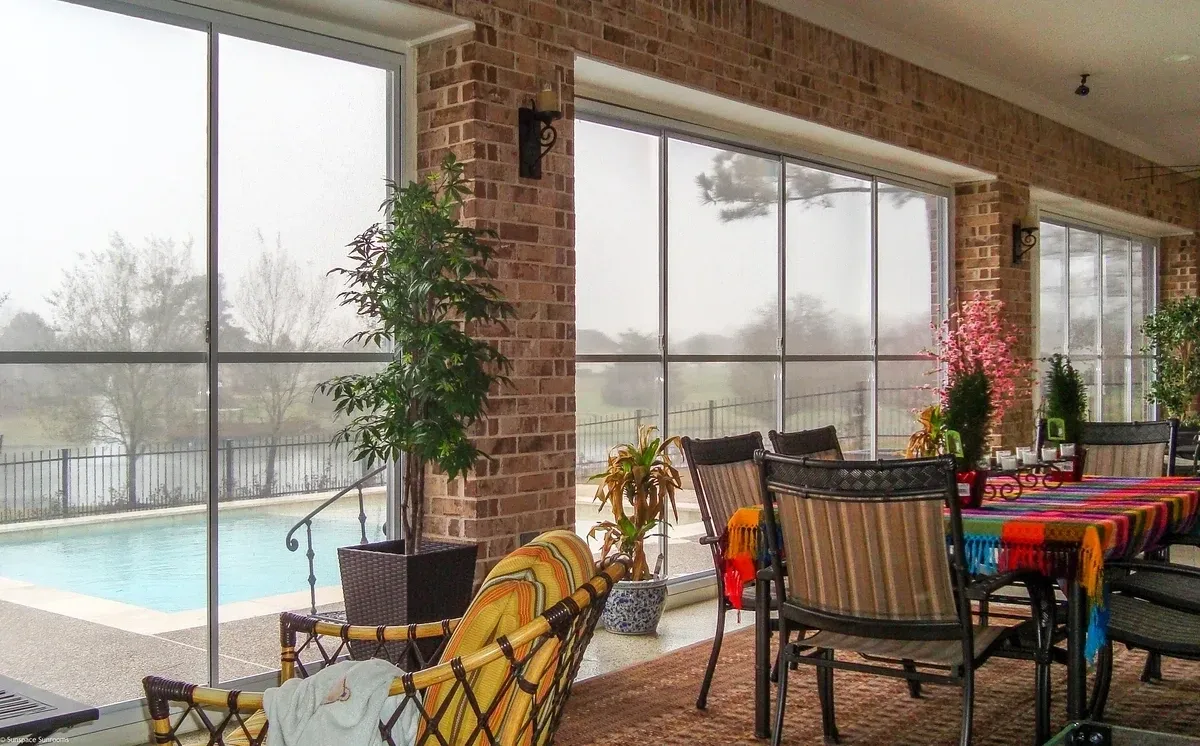 Enclosed patio overlooking swimming pool