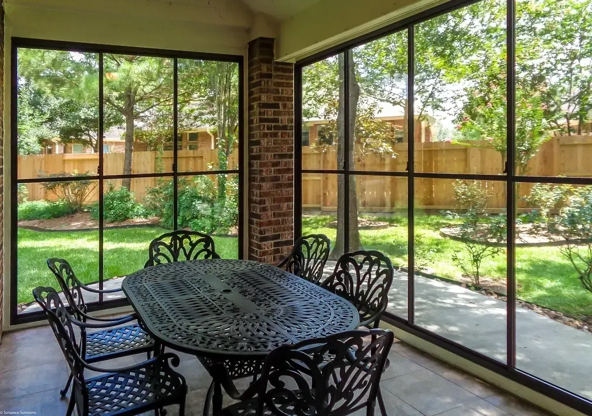 Enclosed patio overlooking backyard garden