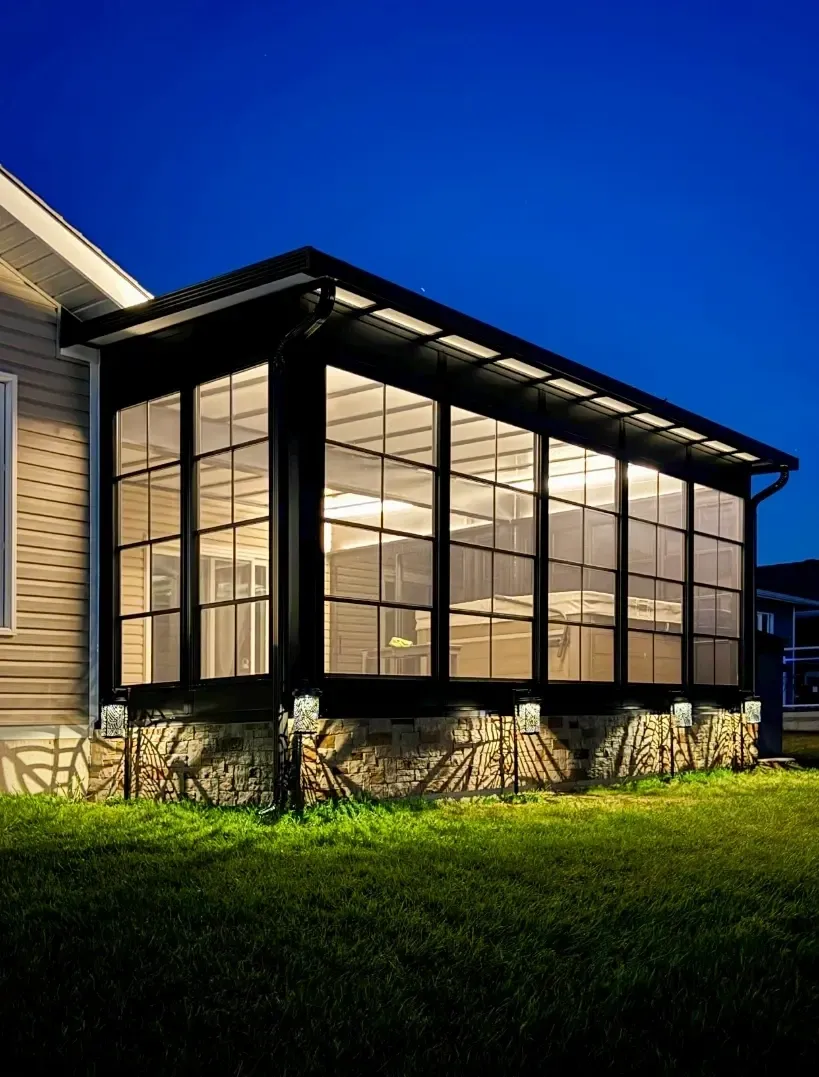Contemporary sunroom exterior during evening