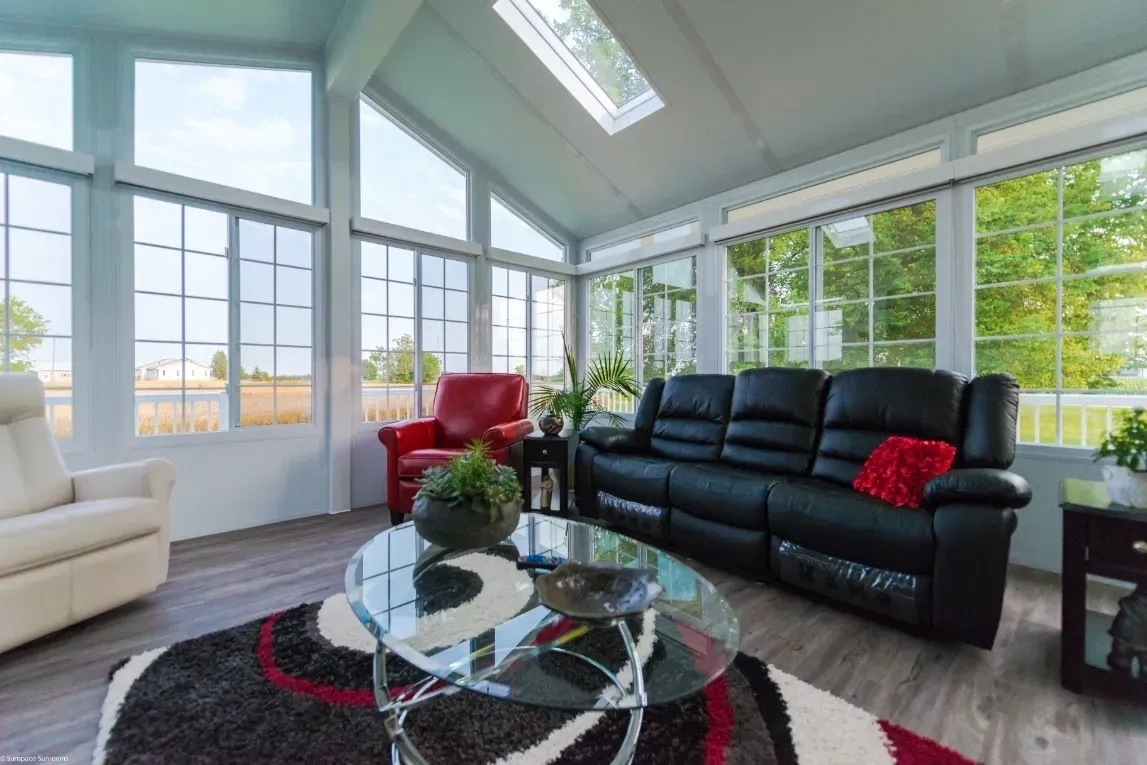 Stylish sunroom with glass table