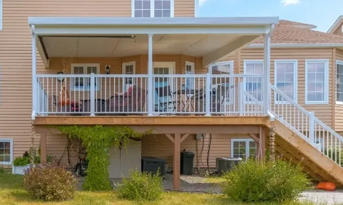 Covered outdoor deck with railing