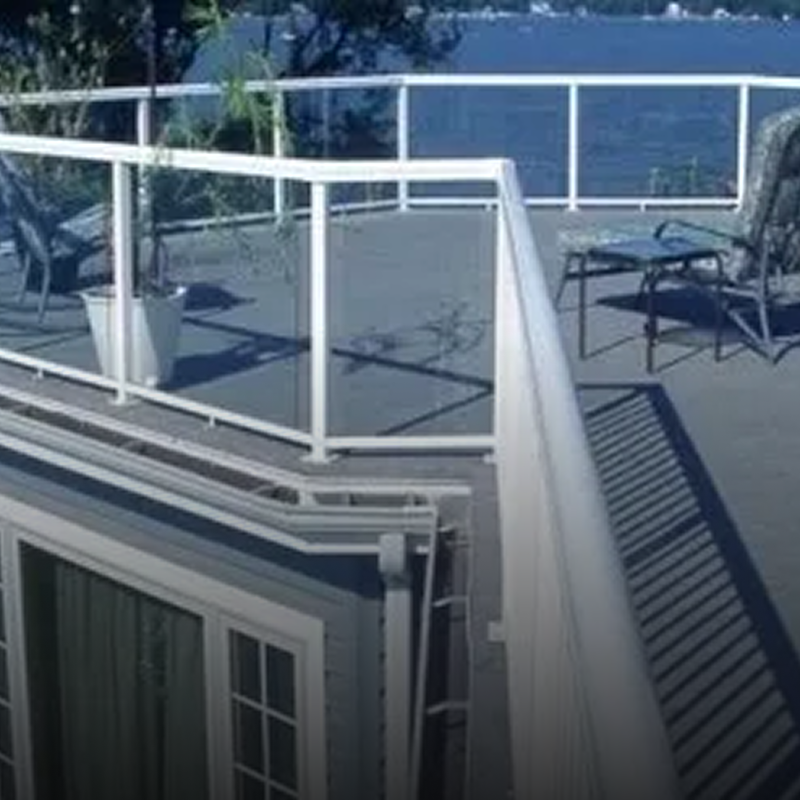 Outdoor patio with railing and seating