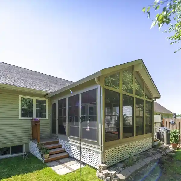 Green house exterior with porch