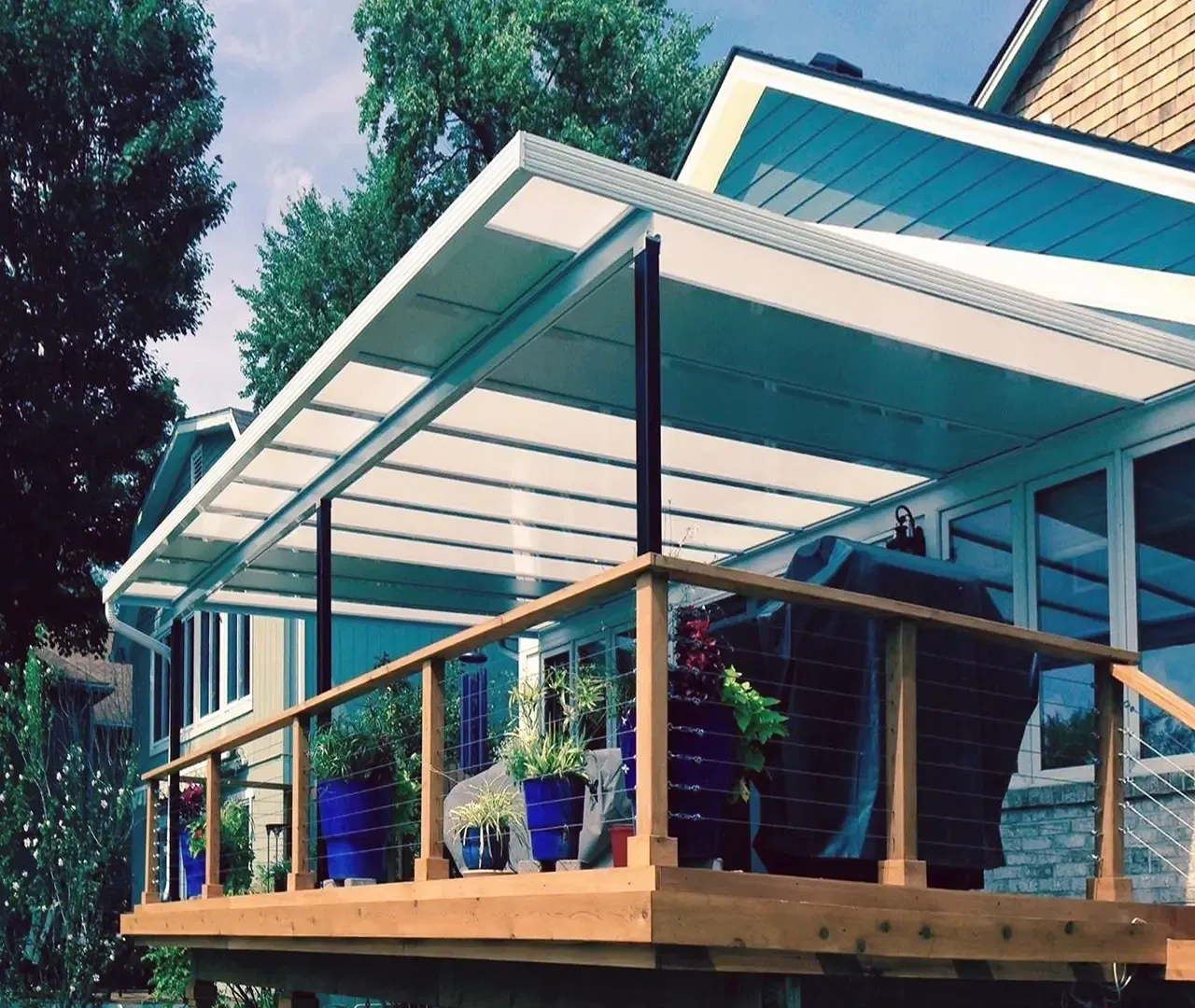 Modern patio with white pergola and plants