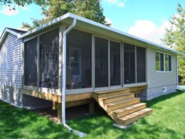 Screened porch with wooden steps