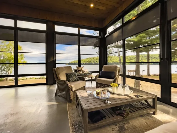 Sunlit room with panoramic lake view