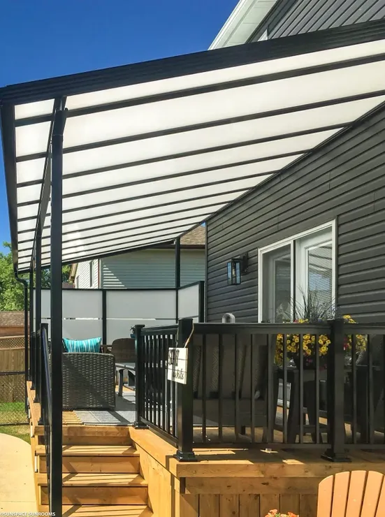Sunny backyard patio with furniture