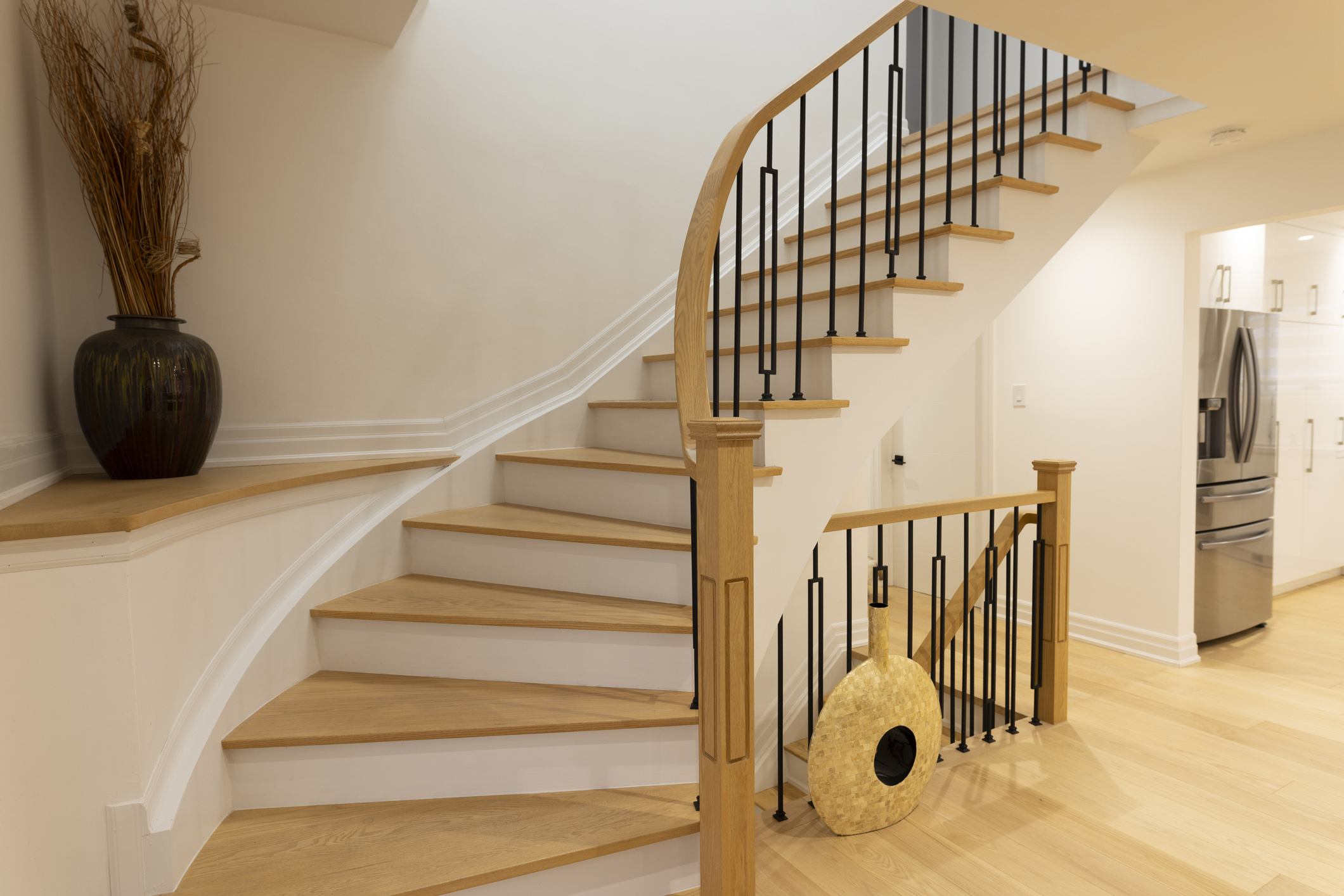 Hardwood stairs with railing in a contemporary Canadian home