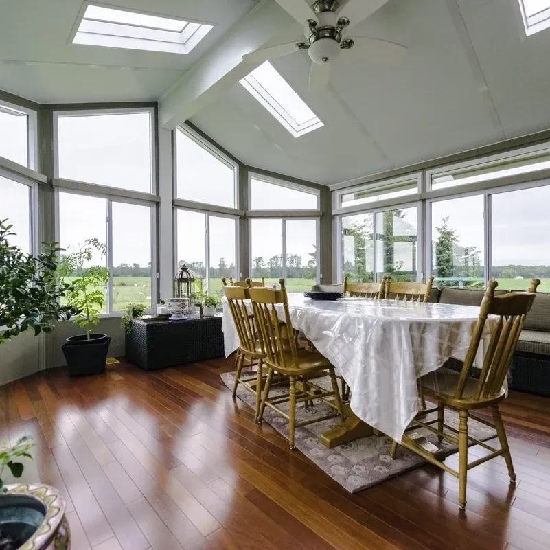 Sunlit conservatory with dining table