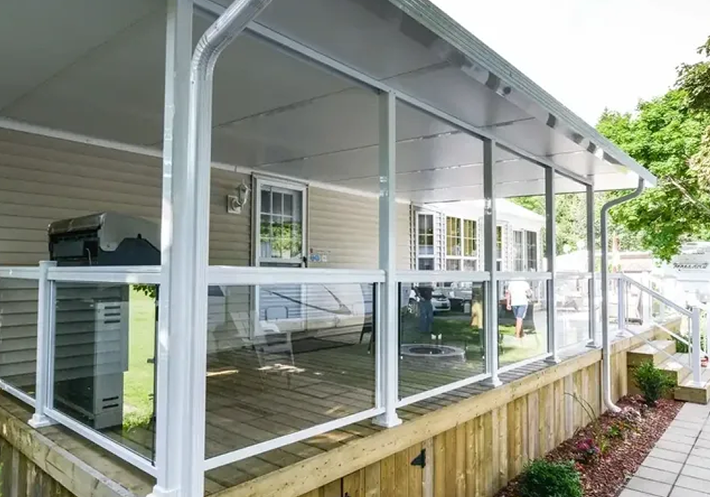 Enclosed porch with white railing