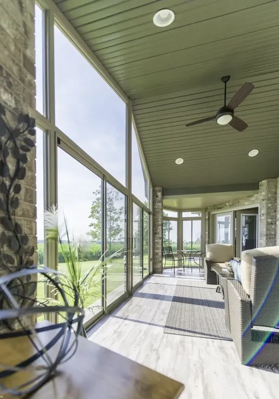 Elegant enclosed porch with ceiling fan